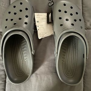 Brand new men’s Crocs size 13